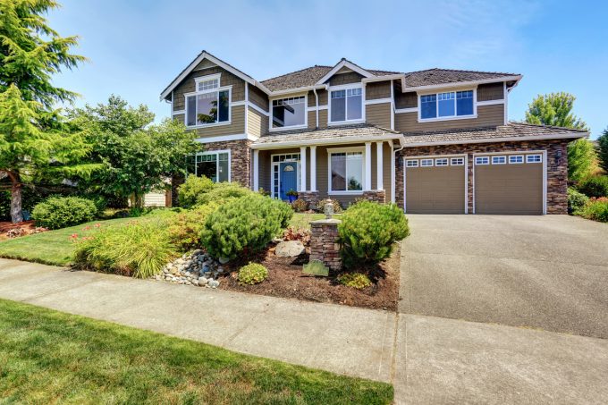 Awesome Exterior Home Design With Centurion Stone And Gable Roof Plus Loewen Windows And Garage Doors Also Concrete Driveway