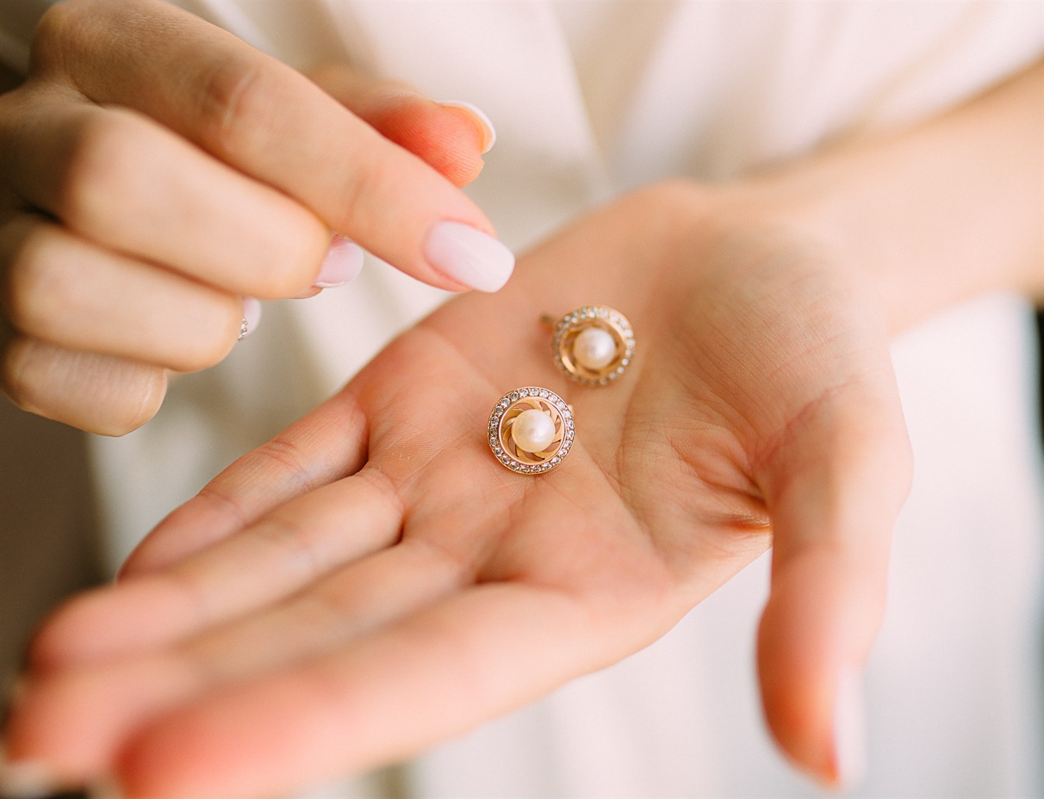 earrings in hand